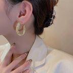 GlowAura™ Twist Earrings – Elegant Sparkling Statement Jewelry