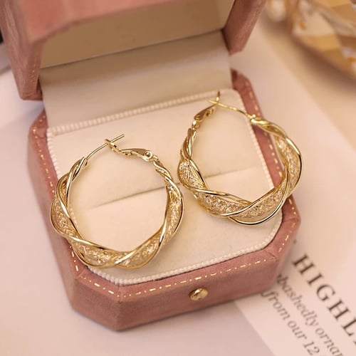 GlowAura™ Twist Earrings – Elegant Sparkling Statement Jewelry