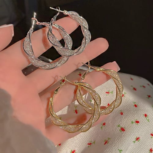 GlowAura™ Twist Earrings – Elegant Sparkling Statement Jewelry