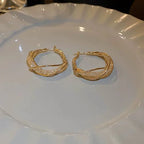 GlowAura™ Twist Earrings – Elegant Sparkling Statement Jewelry