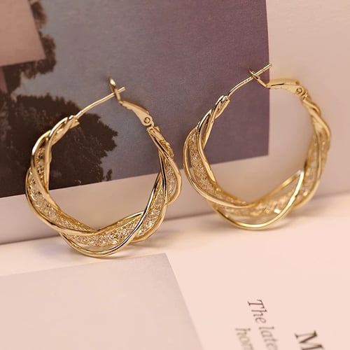 GlowAura™ Twist Earrings – Elegant Sparkling Statement Jewelry